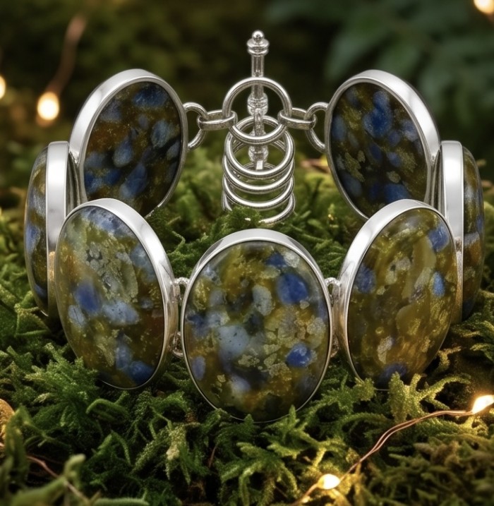 Bochemian Style Beauty 149.5 carat Rare Stichtite .925 Sterling Silver handcrafted Bracelet - Close-up of Bohemian style Stichtite bracelet on moss background