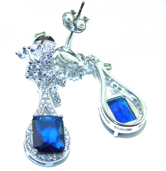 Pear cut 4.5 carat Sapphire .925 Sterling Silver handcrafted incredible earrings - Close-up of sapphire earrings in sterling silver with teardrop design.