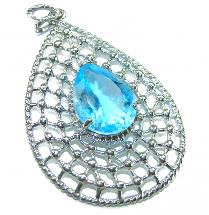 Pacifica 12.5 carat authentic Blue Topaz .925 Sterling Silver Handcrafted pendant - Blue topaz pendant on sterling silver, top angle view.