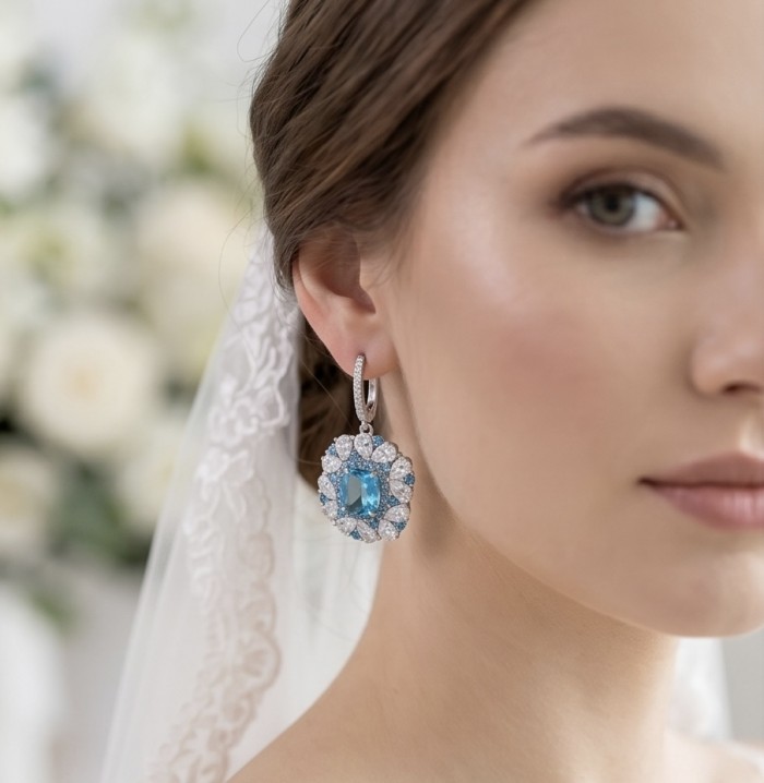 Atlantica 19.7 carat Genuine Aquamarine RHODIUM OVER .925 Sterling Silver Handcrafted Statement earrings - Close-up of aquamarine earring worn by a bride.