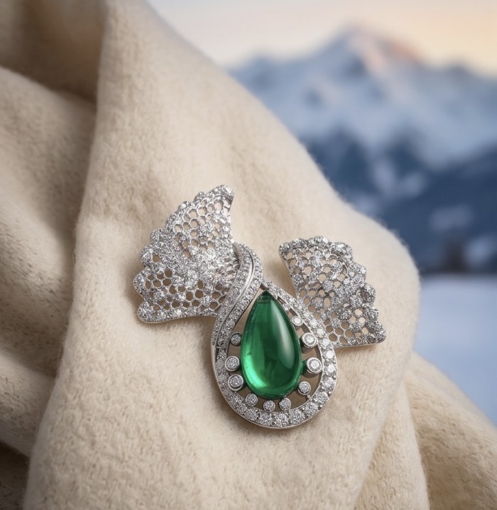 Black Label Collection - Retro Style - Genuine 10.5 carat Colombian Emerald .925 Sterling Silver handmade Brooch - Genuine 10.5 carat teardrop emerald brooch on cream fabric, front view.
