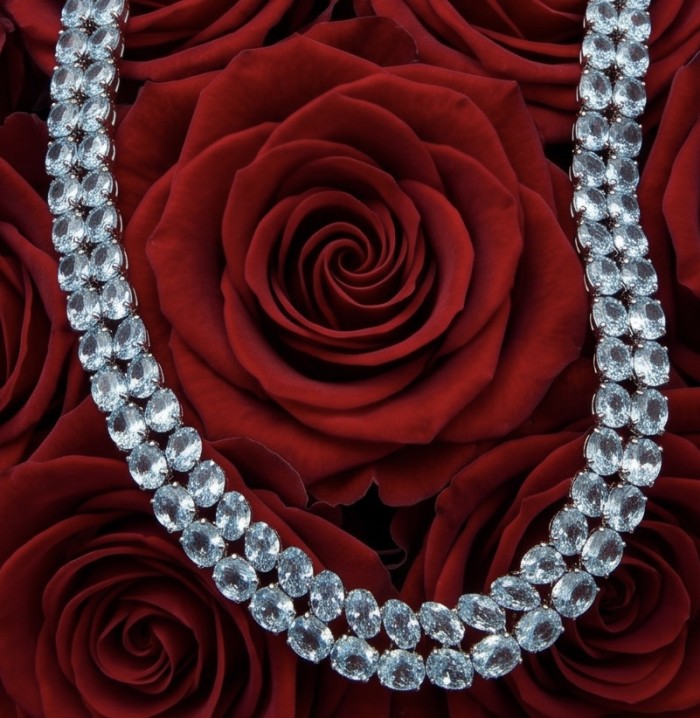 Serenity 205.5 carat genuine Swiss Blue Topaz .925 Sterling Silver handmade Large Statement Necklace; 70.95 grams - Necklace on roses, Swiss Blue Topaz close-up, front view.