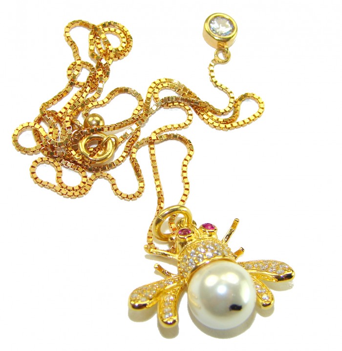 Precious Bees Genuine Pearl 14K Gold Gold over .925 Sterling Silver handcrafted handcrafted Necklace - Bee pendant necklace in gold with pearl, top view, chain coiled around.