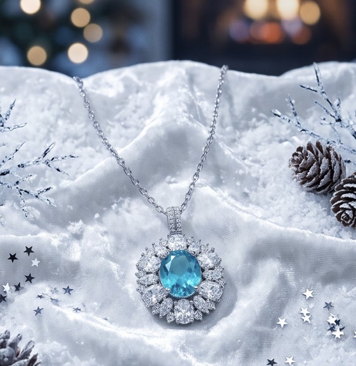 Wonderland 6.2 carat fancy oval cut Paraiba Tourmaline .925 Sterling Silver Handcrafted Statement necklace - Necklace with oval Paraiba Tourmaline on snowy backdrop, top view