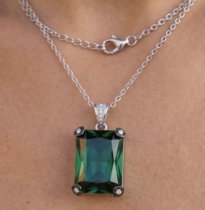 Tiffany - Authentic 29.5 CARAT Chrome Diopside .925 Sterling Silver handcrafted necklace - Necklace with green gemstone pendant worn on neck, displaying clasp detail.
