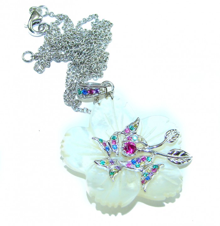 Precious White Flowers Blister Pearl .925 Sterling Silver Necklace - White flower pendant with colorful gems on silver chain, top view.