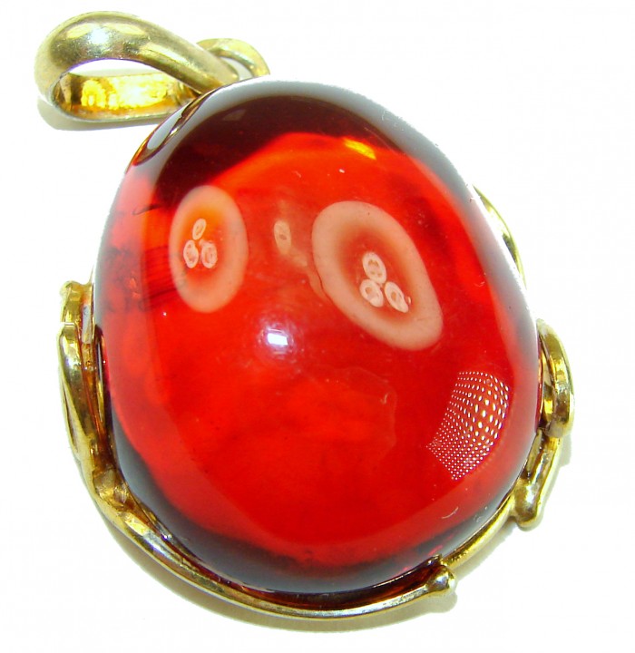 Prehistoric Authentic Baltic Amber .925 Sterling Silver dippedin 14K Gold beautifully handcrafted Pendant - Close-up of prehistoric Baltic amber pendant with gold-plated loop.