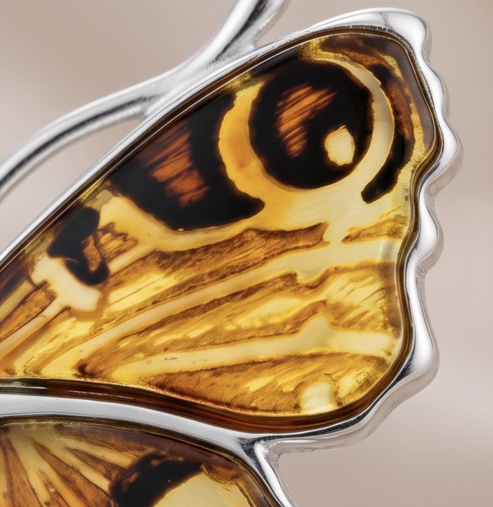 Golden Butterfly Authentic carved Baltic Amber 18K Gold over .925 Sterling Silver handcrafted pendant - Close-up of butterfly wing detail in carved Baltic amber 18K gold setting