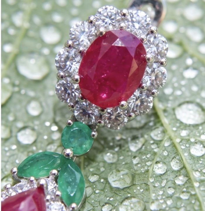 Bella Rossa - Magnificent Jewel 15.5 carat Mozambique Ruby .925 Sterling Silver dippedin Rhodium handcrafted earrings - Close-up of Bella Rossa 15.5 carat Mozambique ruby and emerald jewelry.