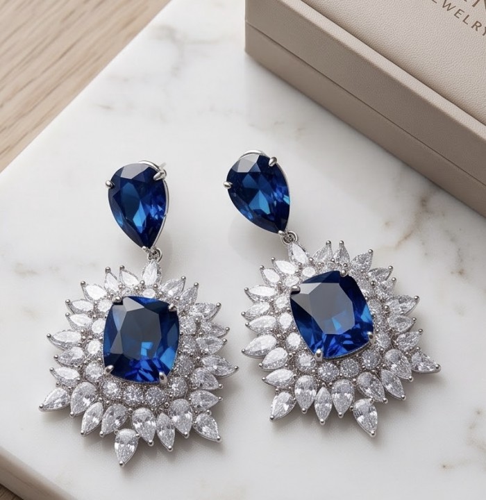 Giuseppina - Authentic 15.5 carat Amethyst Sapphire rhodium over .925 Sterling Silver handcrafted Statement earrings - Close-up of Giuseppina earrings with sapphires and diamonds on marble surface.