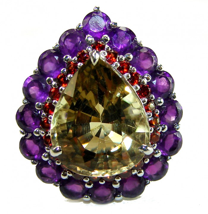 Solid 19.8 carat Genuine Lemon Quartz .925 Sterling Silver handcrafted ring size 6 3/4 - Close-up of lemon quartz ring with purple and red gemstone accents.