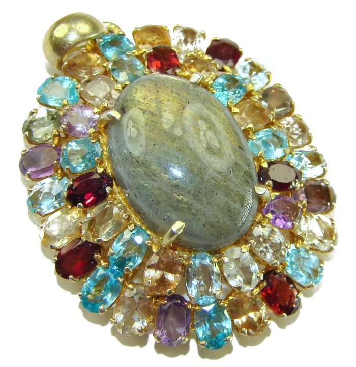 Magical Aurora 55.5 carat Fire Labradorite .925 Sterling Silver dipped in 14K Gold handcrafted Pendant - Close-up of a colorful gemstone pendant with central labradorite stone