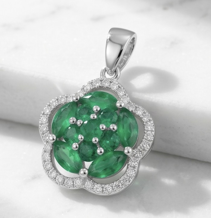 Authentic 4.5 CARAT Chrome Diopside .925 Sterling Silver Pendant - Flower-shaped pendant with chrome diopside and silver, close-up view