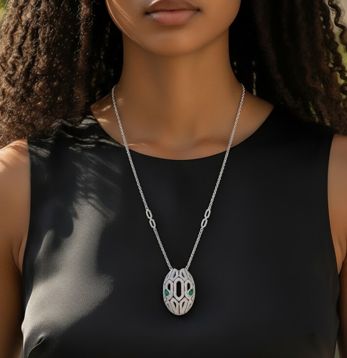 Great Masterpiece Snake's Head genuine 4.1 carat Colombian Emerald .925 Sterling Silver handmade necklace - Necklace worn, close-up view showing the intricate snake's head design.