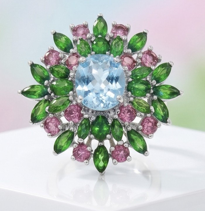 Exquisite 19.7 carat Swiss Blue Topaz rhodium over .925 Sterling Silver Handcrafted Statement Ring size 9 - Top view of exquisite Swiss Blue Topaz ring with green and pink accents.
