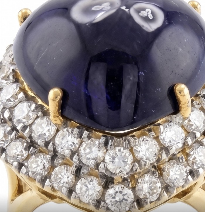 Blue Angel's Heart - Iconic design - Genuine 22.5 carat Sapphire .925 Sterling Silver dipped in 22K Gold handcrafted Ring size 6 - Close-up of jewelry with a large blue stone and diamond accents