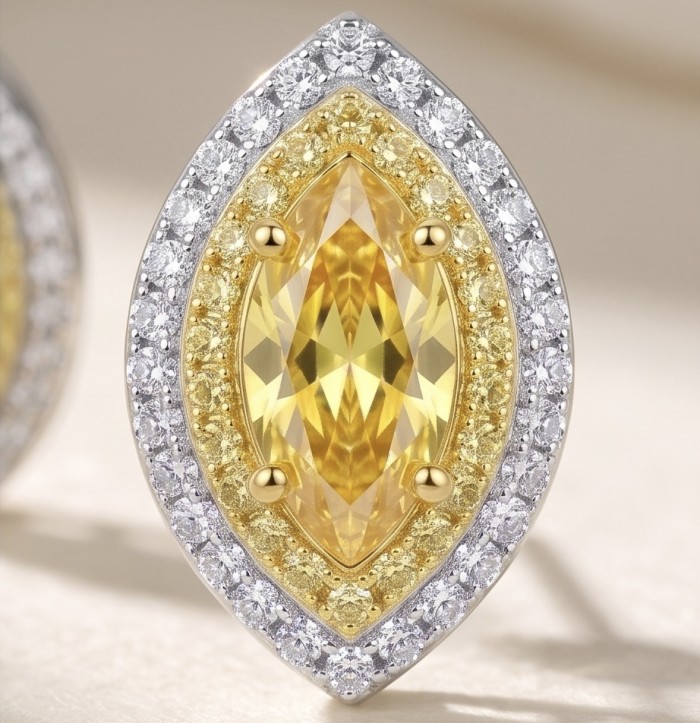 Luxurious 2.4 carat Yellow Sapphire from Ceylon .925 Sterling Silver dipped in Rhodium handcrafted earrings - Close-up of marquise-cut yellow sapphire with diamond halo detail.