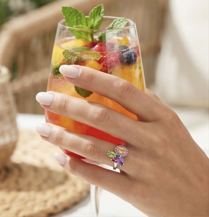 Summer - authentic 7.5 carat multigem .925 Sterling Silver Ring size 8 - Worn on hand, close-up of multigem ring with a summer drink.