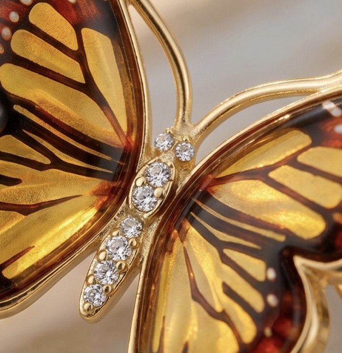 Golden Butterfly Genuine carved Baltic Amber 18K Gold over .925 Sterling Silver handamde Bracelet - Close-up of golden butterfly brooch with amber wings and diamond accents.