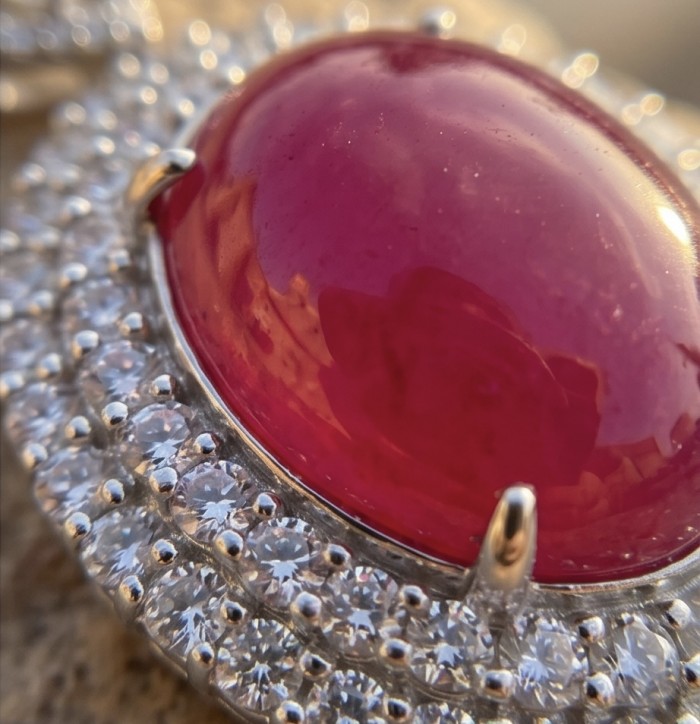 Rare 16.2 carat authentic Kashmir Ruby rhodium over .925 Sterling Silver handmade Statement Pendant - Close-up of rare 16.2 carat Kashmir ruby with diamond accents.