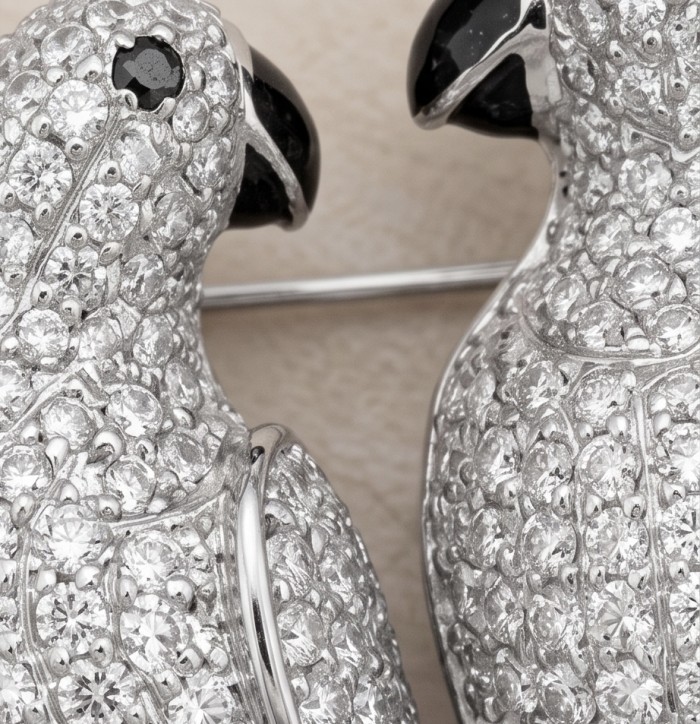 Attract YOUR Luck - Two Parrots 4.2 CARAT pave Moissanite .925 Sterling Silver dipped in rhodium handcrafted Brooch - Close-up of two parrot-shaped Moissanite brooches with diamond detailing.