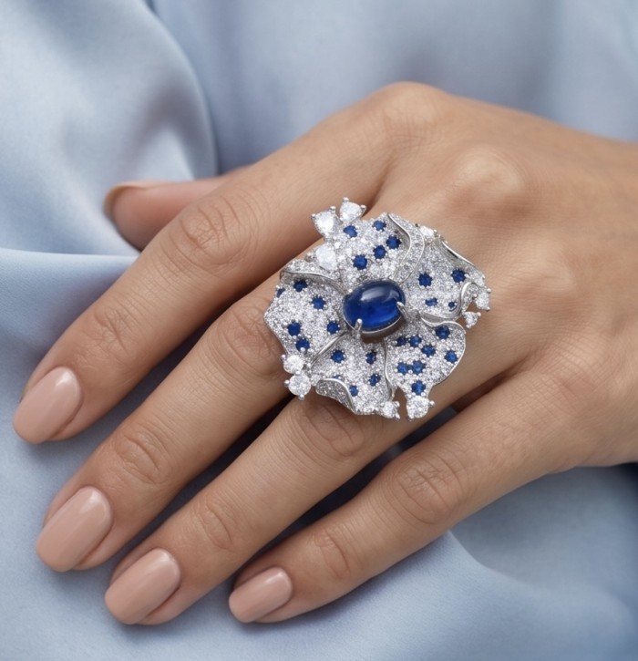 Blue Flower 12.2 carat natural Sapphire .925 Sterling Silver Perfectly handcrafted Ring s. 7 1/4 - Elegant sapphire flower ring worn on hand, showcasing intricate details.