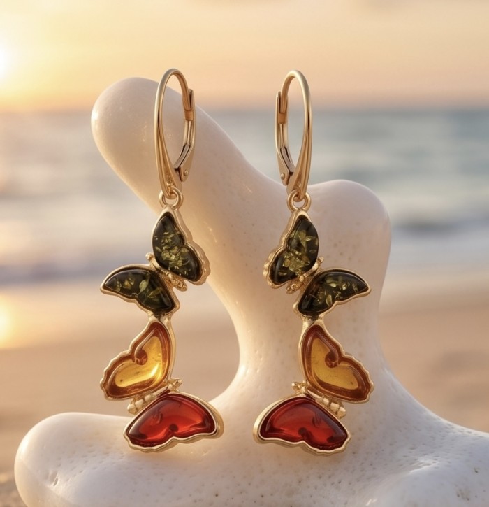 Two Butterflies carved Baltic Polish Amber 18k Gold over .925 Sterling Silver earrings - Butterfly amber earrings with 18k gold on a seashell background.