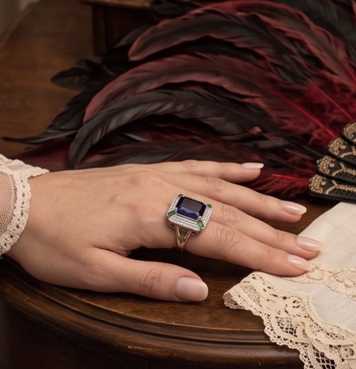 Julietta 15.5 carat Sapphire .925 Sterling Silver handmade Statement ring size 7 1/4 - Sapphire ring worn on hand, lace sleeve, and feather in background.
