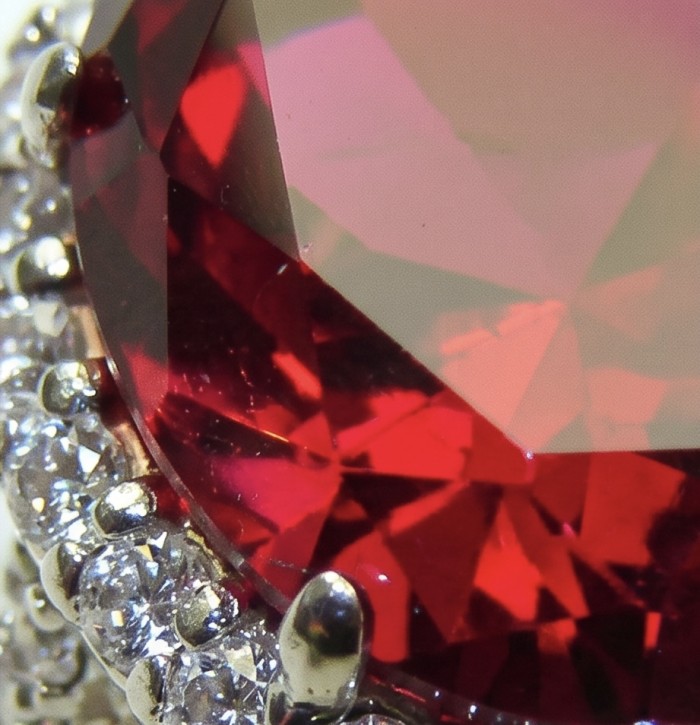 Red Empress 25.7 ctw oval cut Mozambique Ruby .925 Sterling Silver handcrafted Statement Ring size 7 1/4 - Close-up of Red Empress Mozambique Ruby with diamond accents