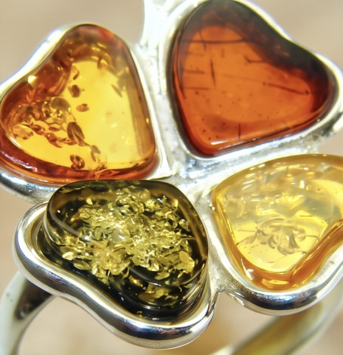 Flower Authentic Baltic Amber .925 Sterling Silver dipped in rhodium handcrafted ring; s. 7 adjustable - Close-up of flower-shaped Baltic amber in sterling silver setting