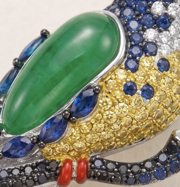 Exotic Parrot - Genuine 18.4 carat Jade from New Zealand .925 Sterling Silver dipped in rhodium handmade Pendant - Brooch - Close-up of exotic parrot jewelry with jade, sapphires, and yellow stones.