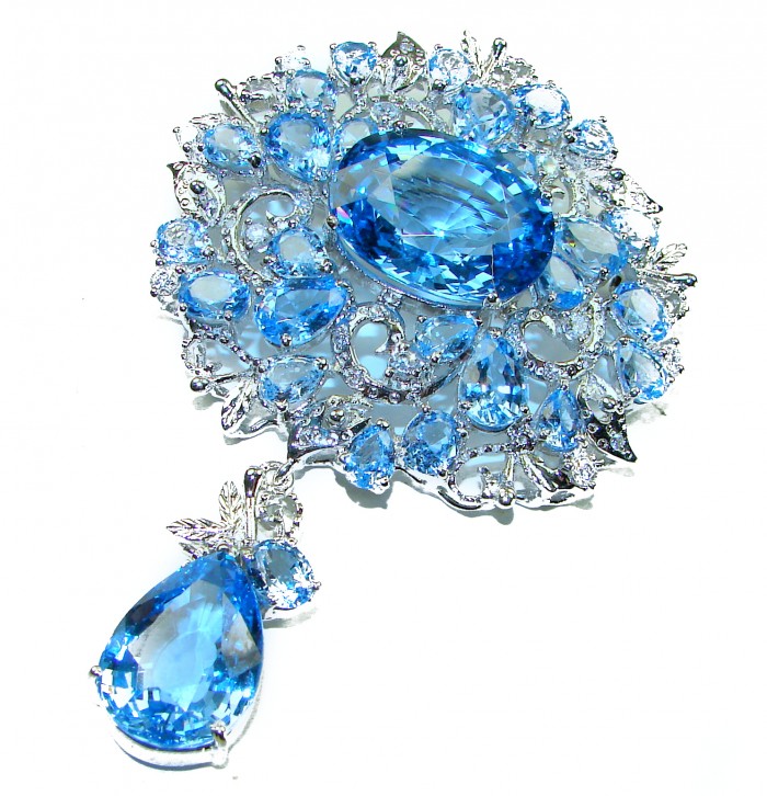 An exuberantly Large 75.5 grams Vintage style Swiss Blue Topaz .925 Sterling Silver DIPPED IN RHODIUM handmade LARGE Pendant - Brooch - Close-up of vintage-style Swiss Blue Topaz brooch with intricate detailing.