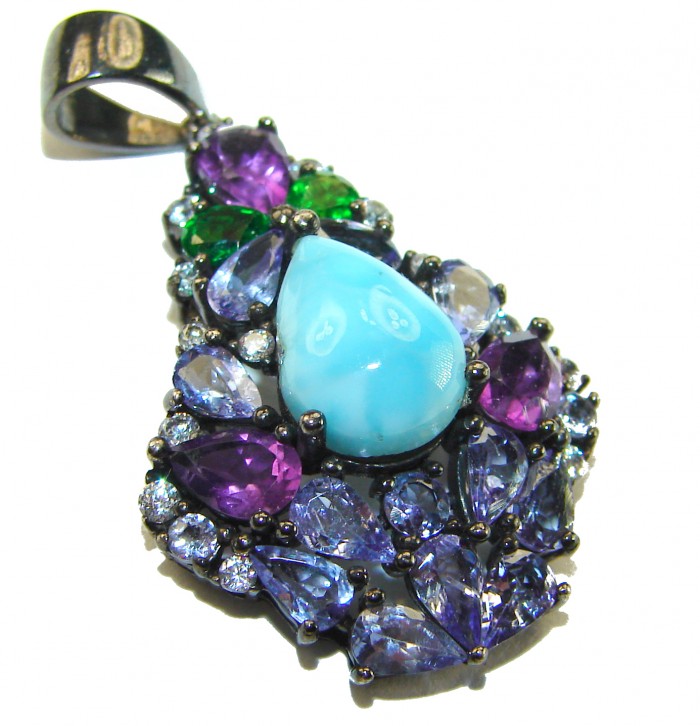Victoria Natural 4.5 carat Larimar from Dominican Republic Tanzanite .925 Sterling Silver dipped in black rhodium handcrafted pendant - Close-up of multicolored gemstone cluster with Larimar centerpiece.