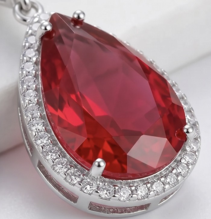 Magnificent Jewel 10.5 carat Ruby .925 Sterling Silver handcrafted incredible earrings - Close-up of a ruby pendant set in sterling silver with diamond accents.