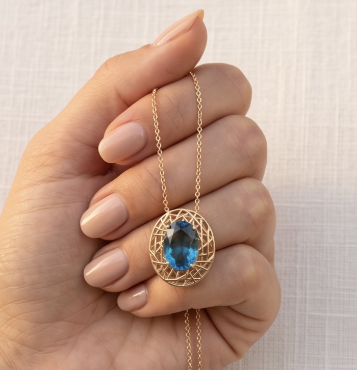 Blue Island - 8.2 carat London Blue Topaz 18K Gold over .925 Sterling Silver handmade Pendant - Stone close-up: 8.2 carat London Blue Topaz pendant in hand.