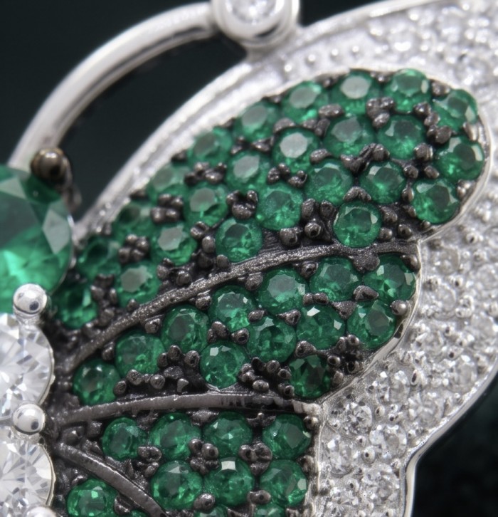Precious Butterfly Genuine 10.5 carat pave Colombian Emerald .925 Sterling Silver handmade Statement Ring size 7 1/2 - Close-up of emerald-studded butterfly jewelry detail.