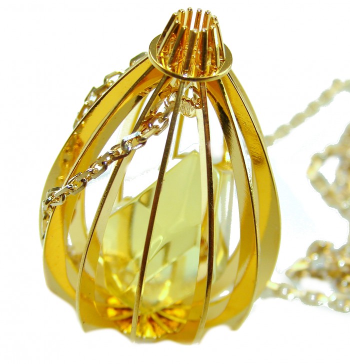 Wonderland Elegant Genuine Baltic Amber 22K Gold over .925 Silver handcrafted Necklace - Close-up of amber pendant in gold cage setting with chain detail