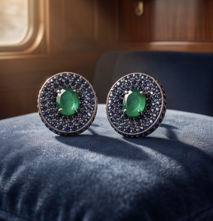 Julietta 19.5 carat Colombian Emerald .925 Sterling Silver handmade LARGE Statement earrings - Close-up of Julietta emerald earrings on a blue cushion