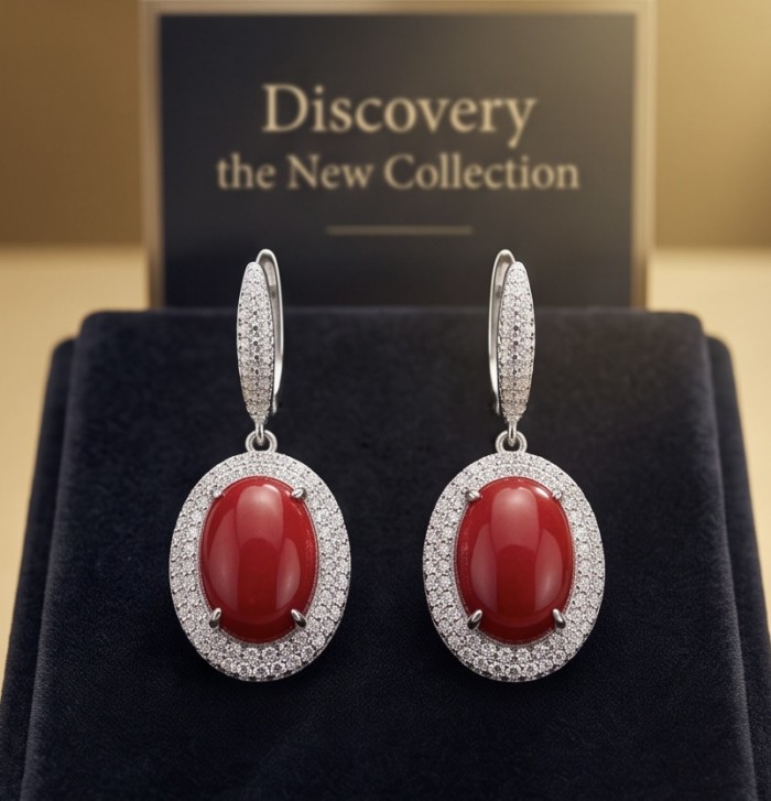 Elizabeth Natural Fossilized Coral 2.8 carat Moissanite .925 Sterling Silver handcrafted earrings - Earrings with red coral and moissanite, front view on display.
