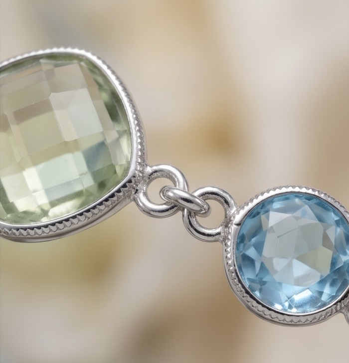 Authentic 22.5 carat Swiss Blue Topaz .925 Sterling Silver handmade Bracelet - Close-up of blue and green gemstones in silver setting