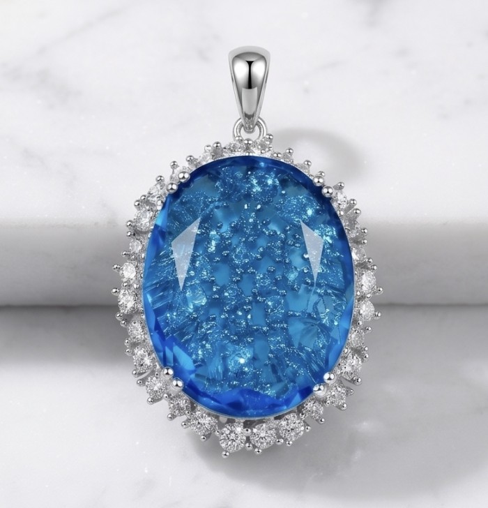Angelina 10.9 carat authentic Swiss Blue Topaz .925 Sterling Silver Handcrafted handmade Pendant - Swiss Blue Topaz pendant with halo, front view on marble background.