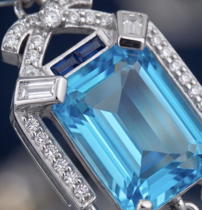 Atlantica - Art Deco- 10.7 carat Swiss Blue Topaz 0.8 CARAT Sapphire .925 Sterling Silver dipped in Rhodium Handcrafted Statement earrings - Close-up of Atlantica art deco jewelry with blue topaz and diamonds.