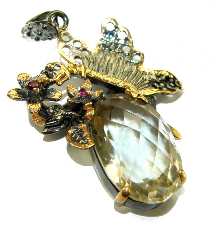 Dramatic design - Green Ivy 21.5 carat Green Amethyst - Prasolite .925 Sterling Silver dipped in black rhodium handcrafted pendant - Close-up of intricate pendant with green amethyst and floral designs.