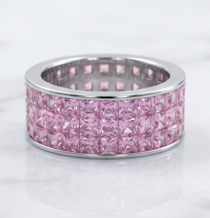 Eternity - authentic pear cut 8.5 carat Pink Sapphire .925 Sterling Silver Handcrafted Statement Ring size 6 - Wide view of pink sapphire eternity band on a reflective surface