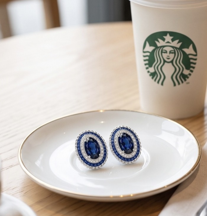 Art Deco - Incredible genuine 10.5 CARAT Sapphire .925 Sterling Silver handcrafted Earrings - Sapphire earrings on plate next to Starbucks cup, top view.