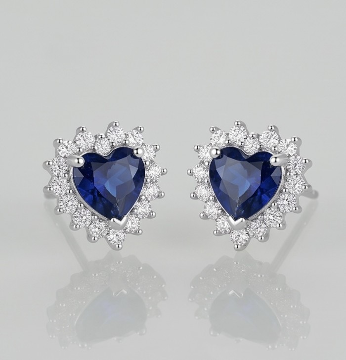 Vintage Beauty 0.8 carat Sapphire .925 Sterling Silver handcrafted earrings - Front view of heart-shaped sapphire earrings with silver setting.