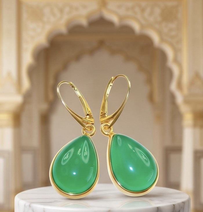 Unique genuine Jade 18K Gold over over .925 Sterling Silver handcrafted earrings - Green jade earrings with gold accents on marble, frontal view.