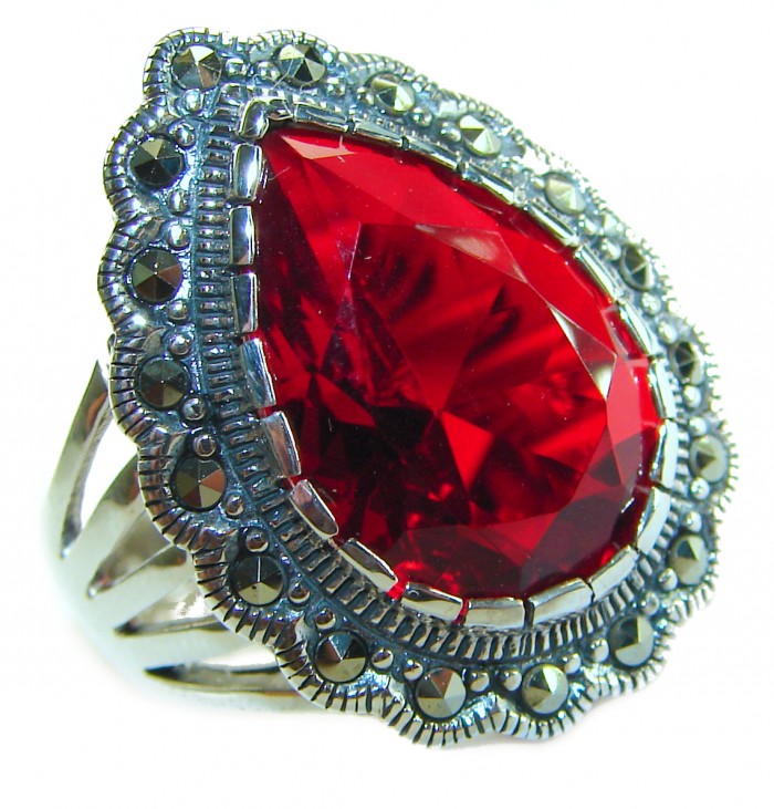 Crimson Fire Authentic 12.4 carat Garnet .925 Sterling Silver brilliantly handcrafted large Statement Ring size 7 1/4 - Close-up of red garnet ring with ornate silver setting.
