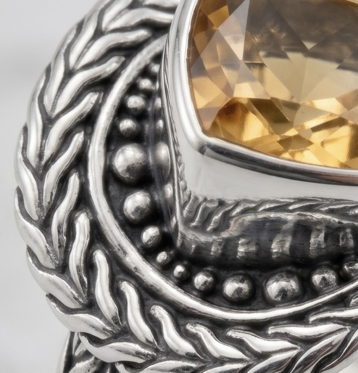 Solid 9.8 carat Genuine Citrine .925 Sterling Silver handcrafted ring size 7 - Close-up of a citrine stone set in ornate sterling silver jewelry.