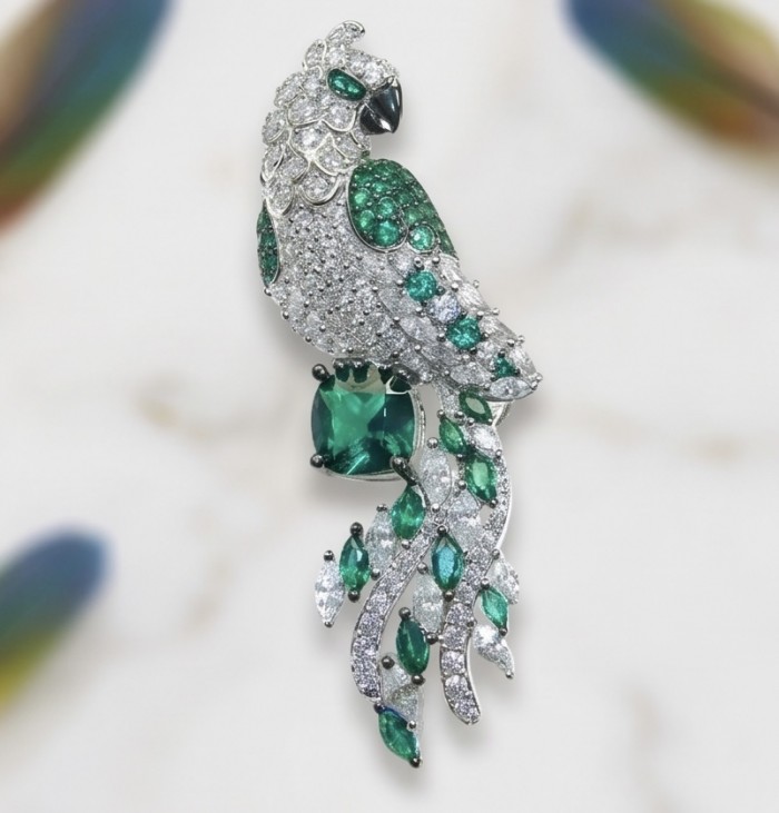 Exotic Parrot - 7.8 carat Emerald 2.9 carat pave Moissanite rhodium over .925 Sterling Silver rhodium over handcrafted Brooch - Side view of Exotic Parrot brooch with emerald and moissanite.